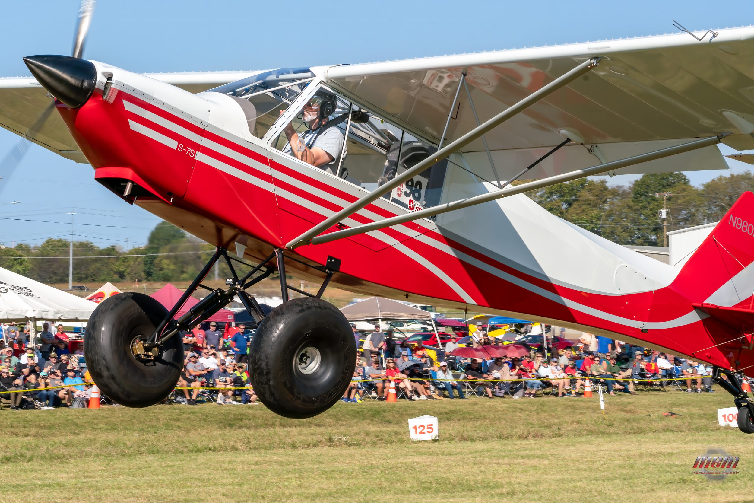A Super Cub crosses the crowd line on short final