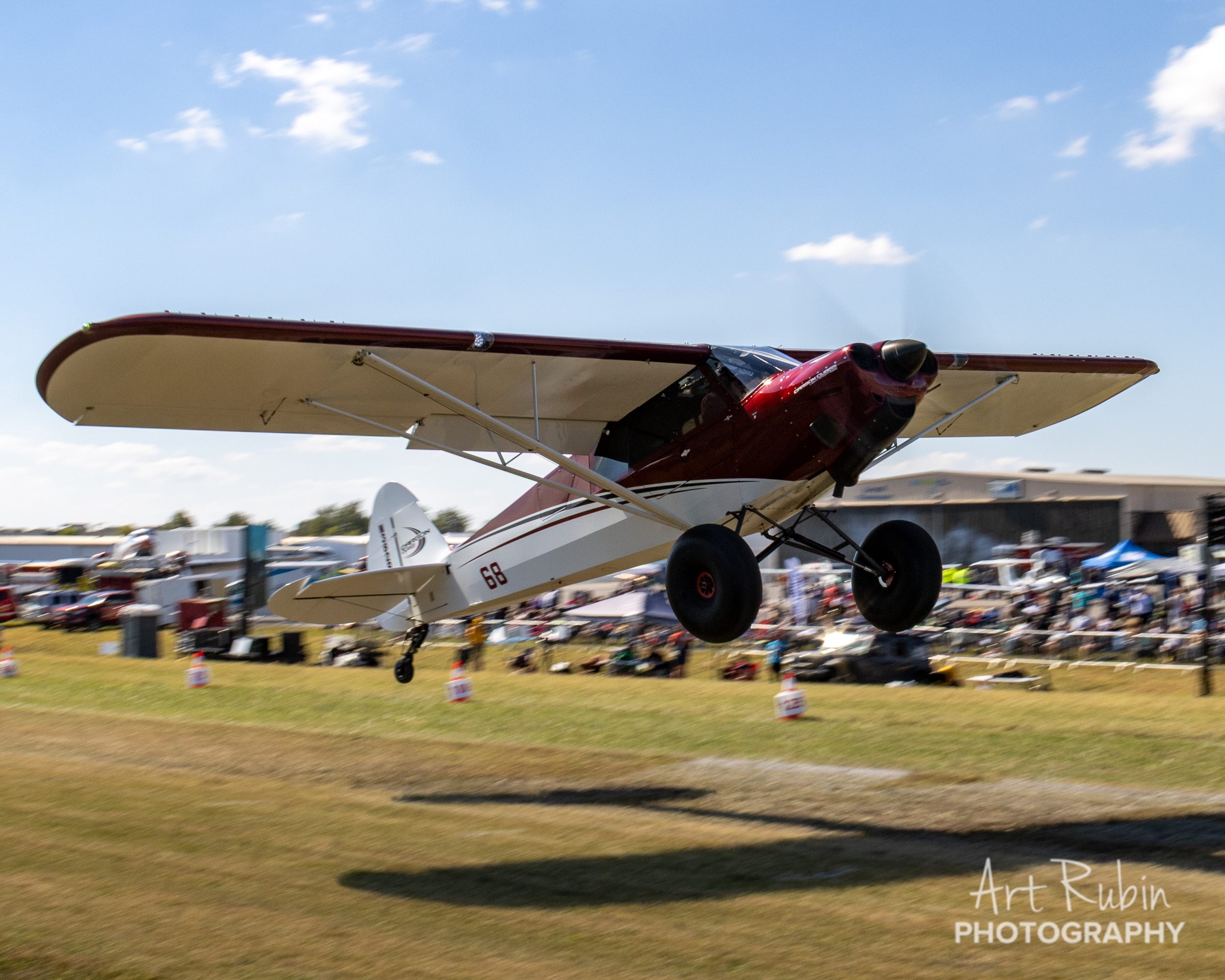 A Carbon Cub settles onto the grass at Music City STOL 2025