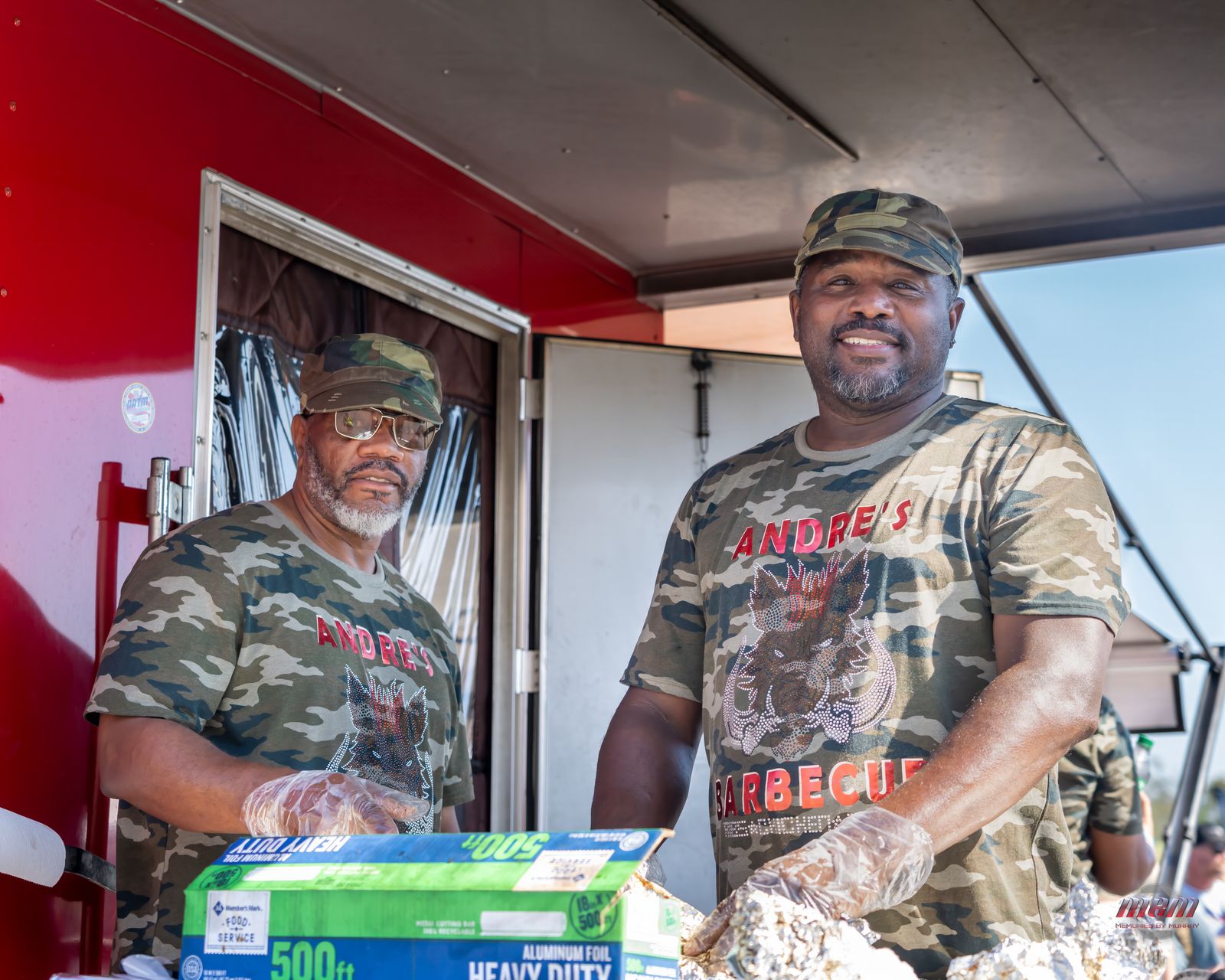 Barbecue food truck crew serving the crowd with a smile