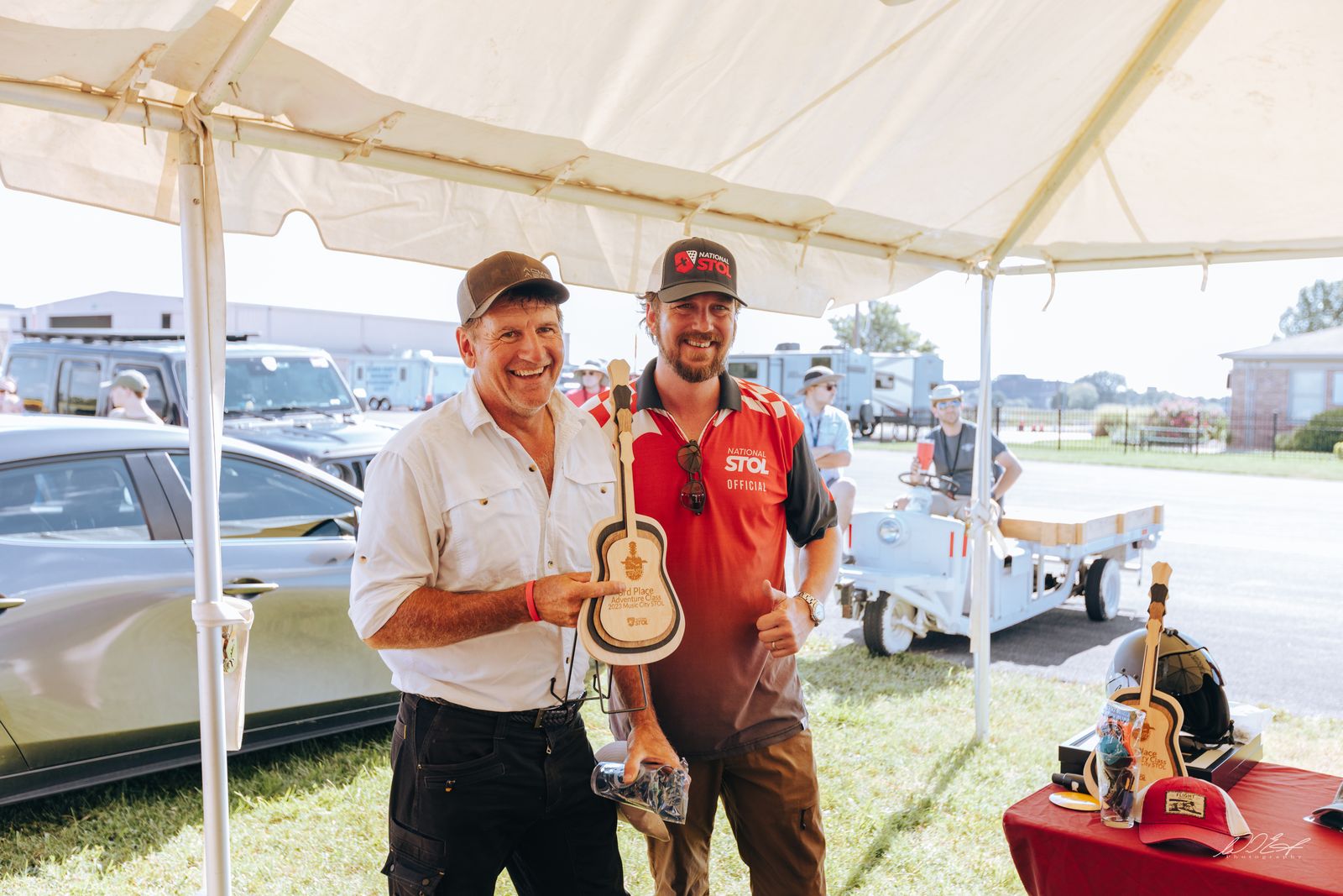 Winners all smiles with their guitar trophies