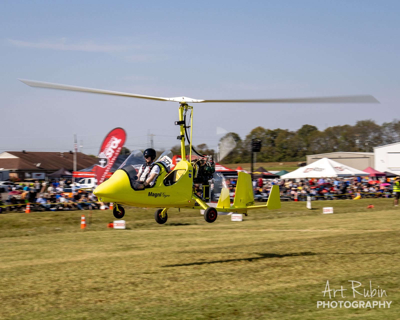 Gyrocopter competing in front of the crowd