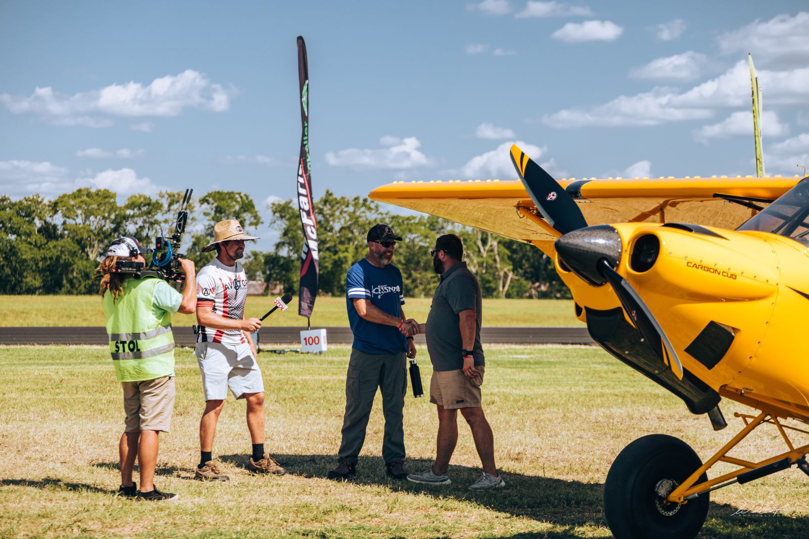 Winner interview with the camera crew on the flight line
