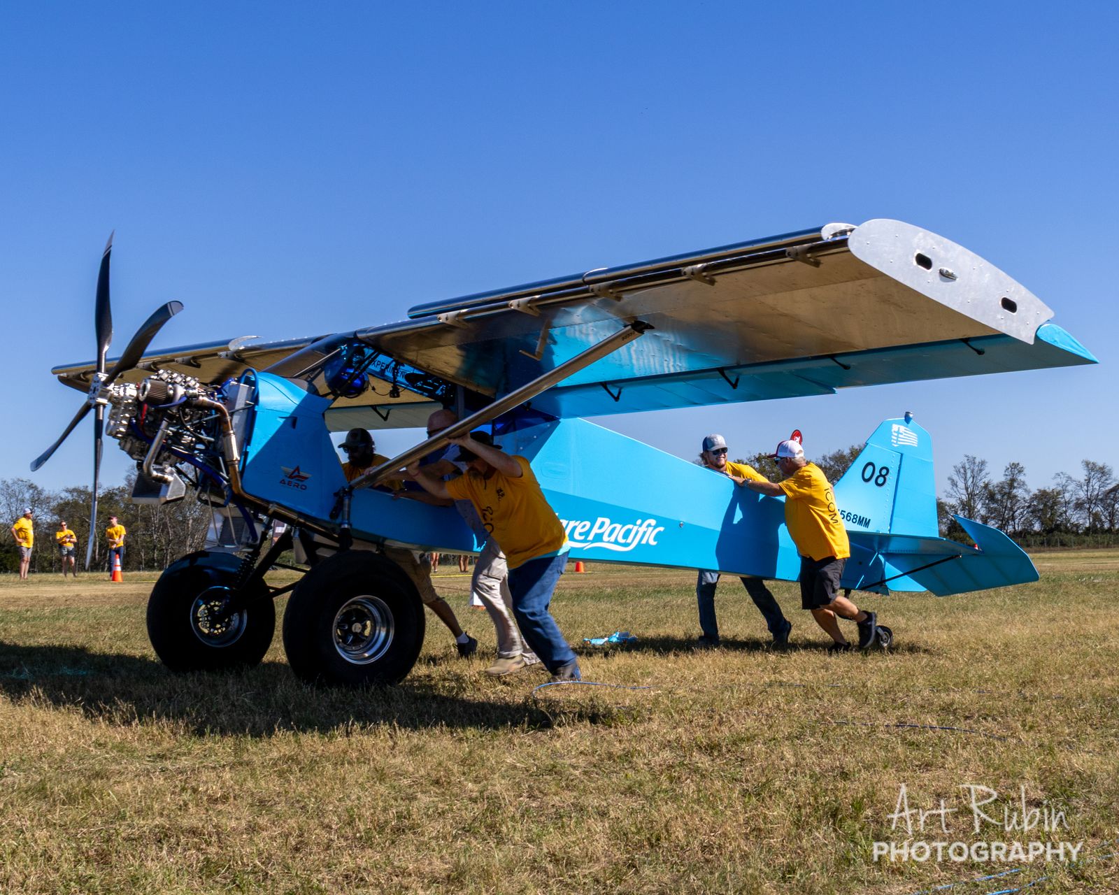Volunteers hand-turning a competitor on the course