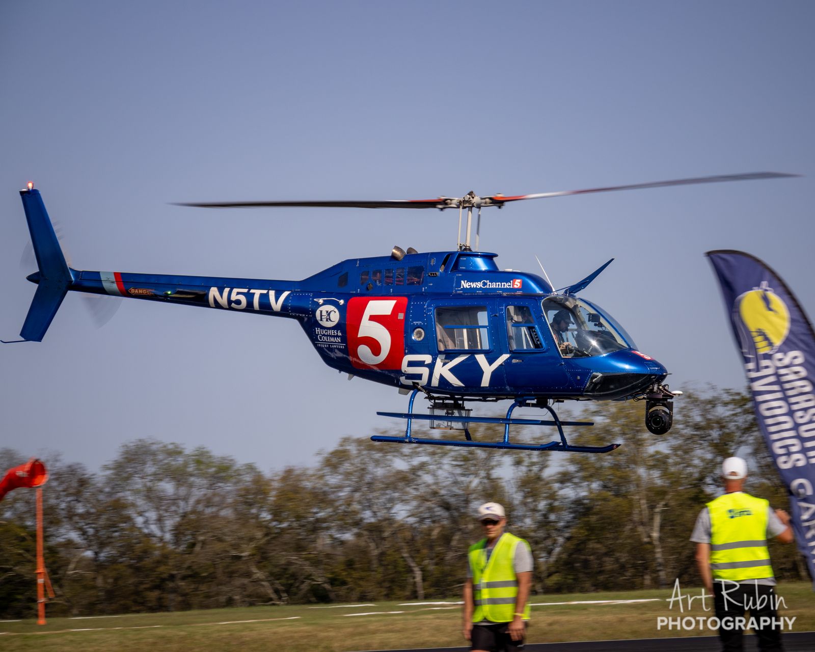News helicopter sweeping low over the line judges