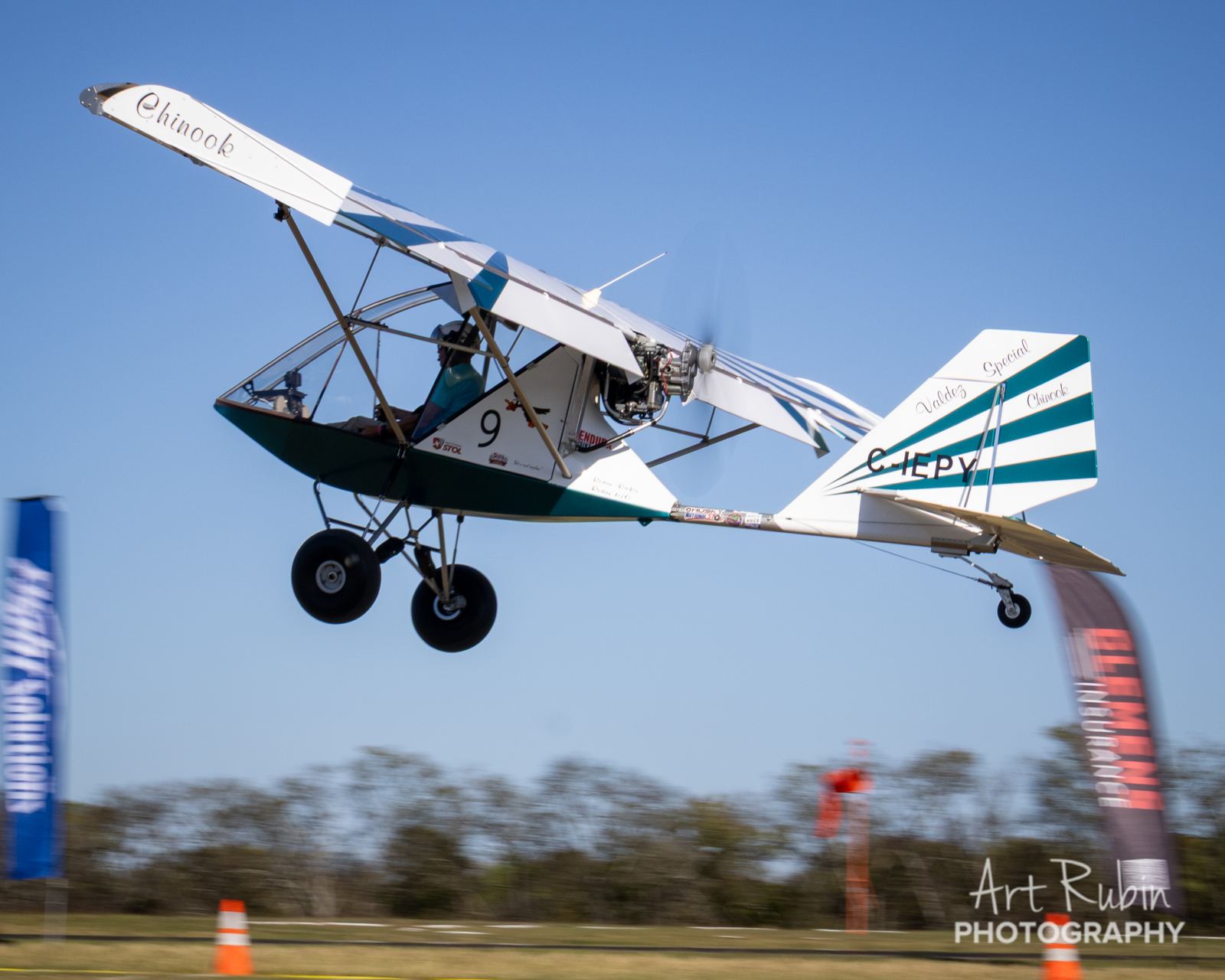 Ultralight competitor airborne just feet off the runway