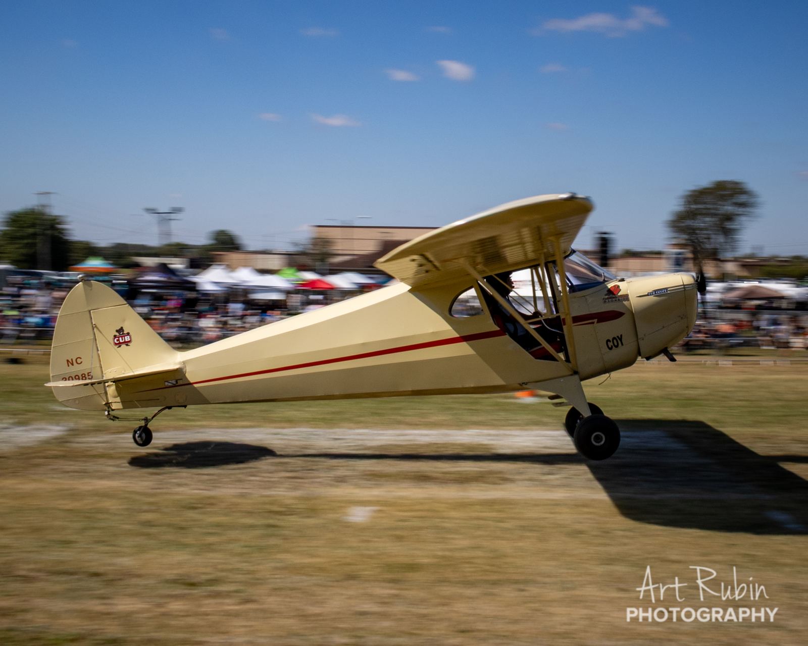 Vintage taildragger taxiing past the spectator area