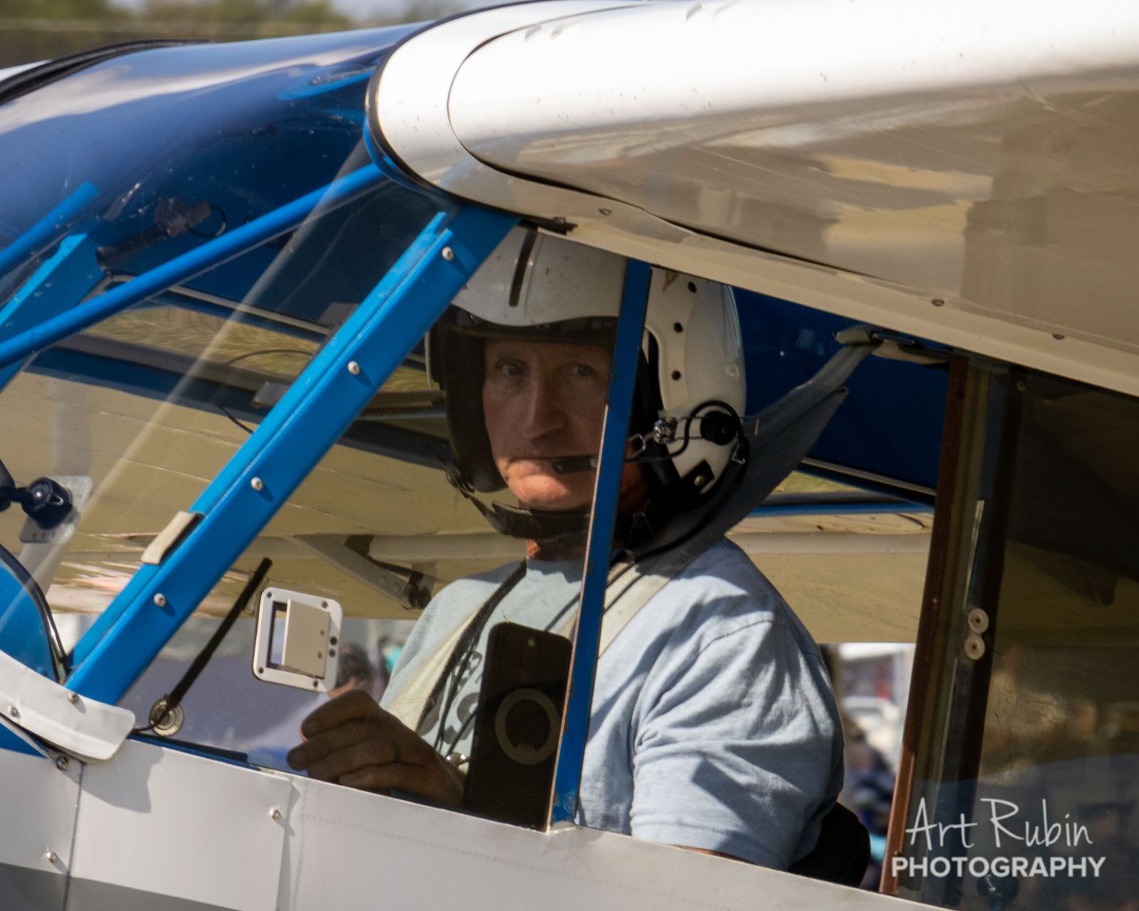 Pilot in the cockpit awaiting the start flag