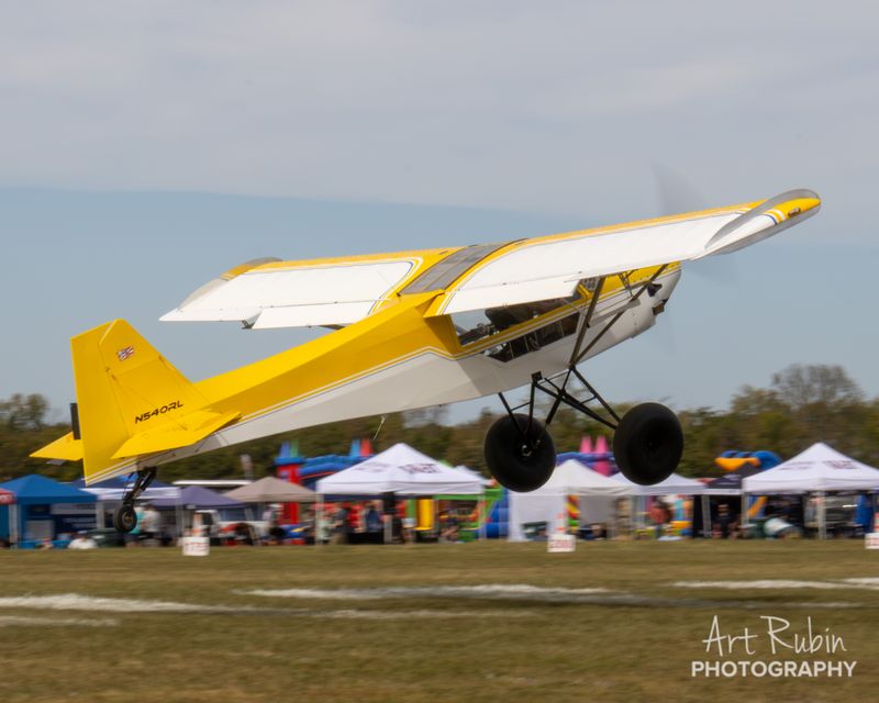 Race 69 · Gary Varga · Rans S-7 N540RL climbing out over the tents