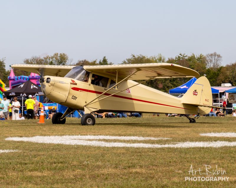 Race 154 · Carl Rose · 1940 Piper J-4A NC30985 taxiing in