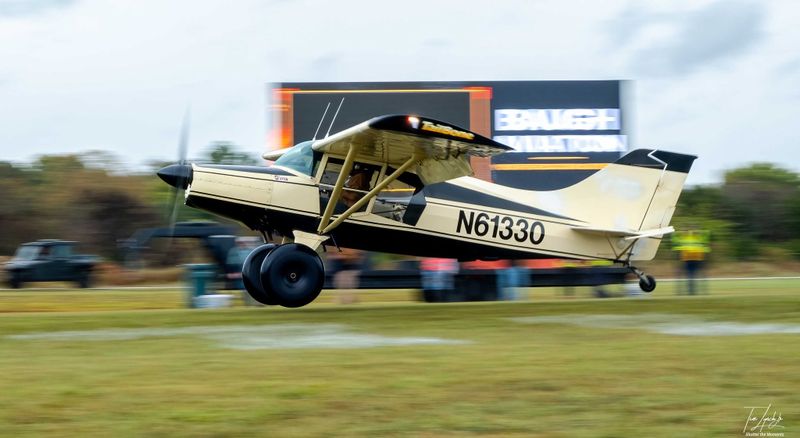 Race 45 · Rick Holman · Maule MX-7 N61330 on short final in front of the sponsor wall