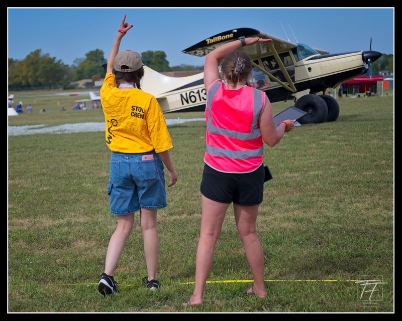 Line judges signaling the mark