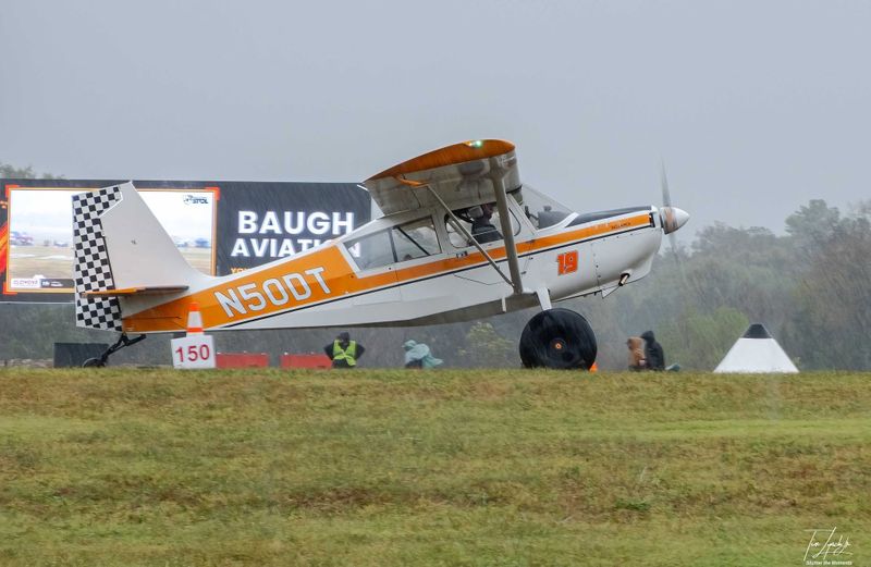 Race 19 · Jeffrey Harrell · Champion Scout N50DT in front of the Baugh Aviation panel