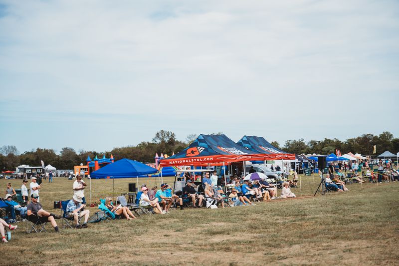 The crowd settles in under the tents